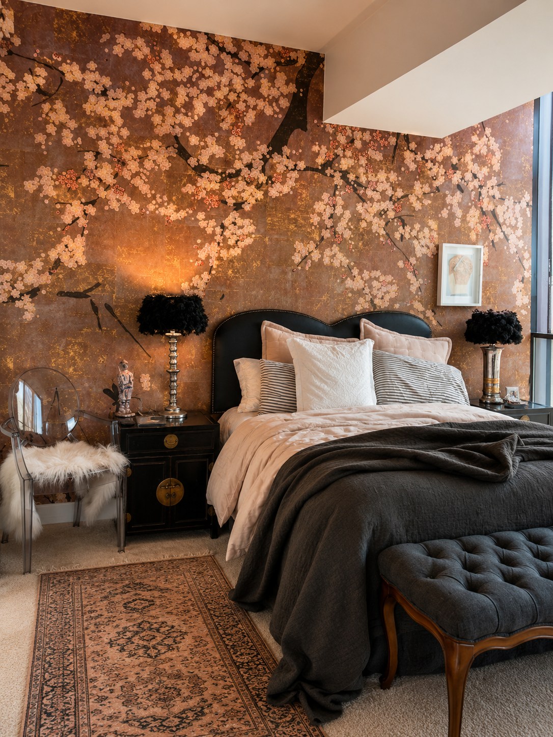 Bedroom with hand-painted gold-leaf cherry blossom wallpaper and a black headboard