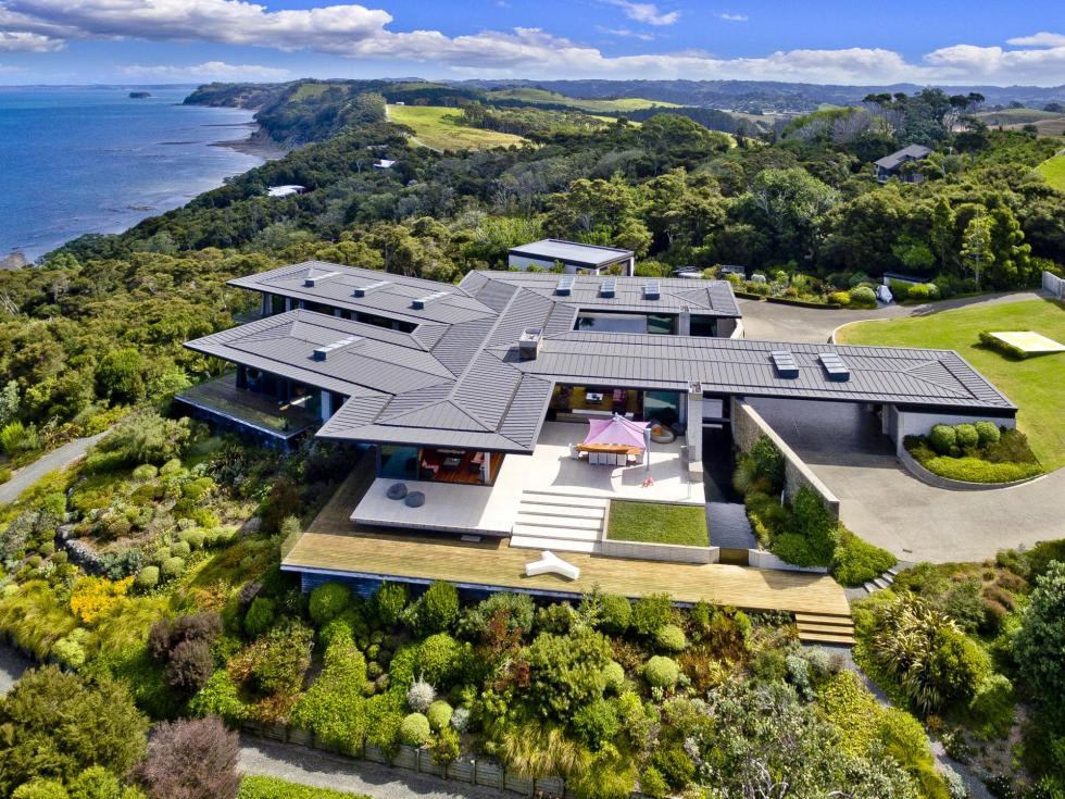 Aerial view of a large architectural new build at Martins Bay, north of Auckland