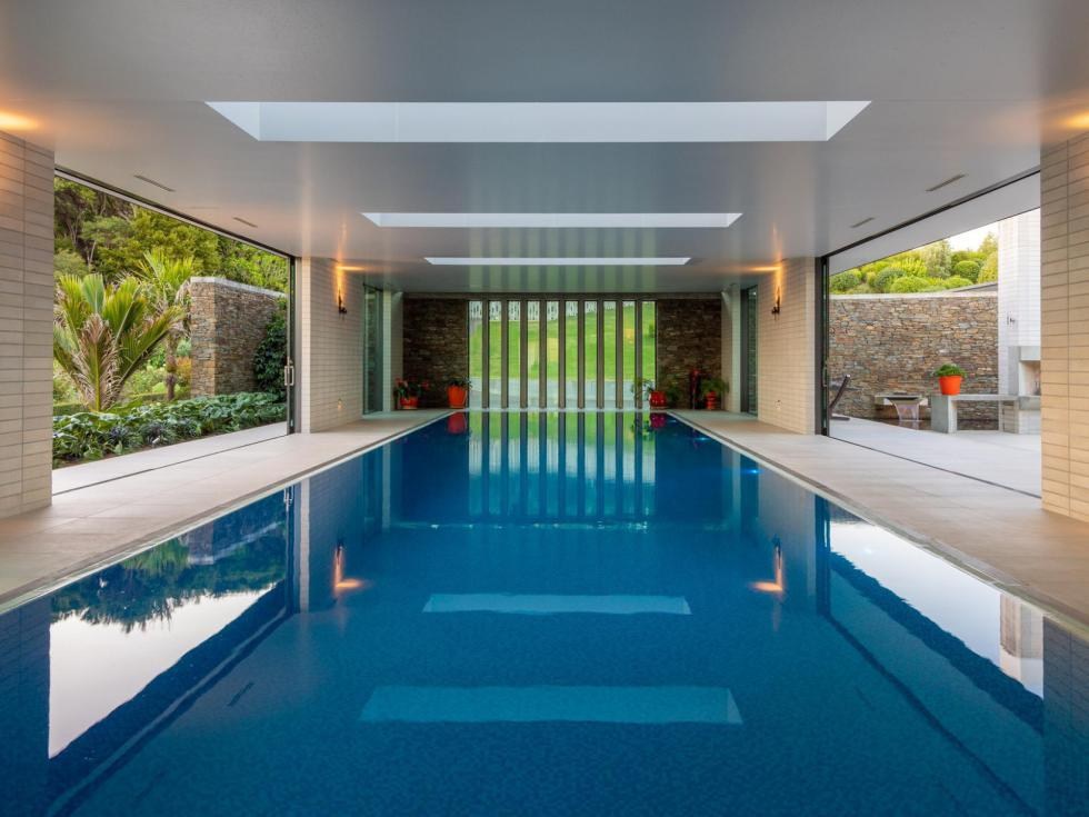 Indoor lap pool opening to the garden through full-width sliding doors, Martins Bay